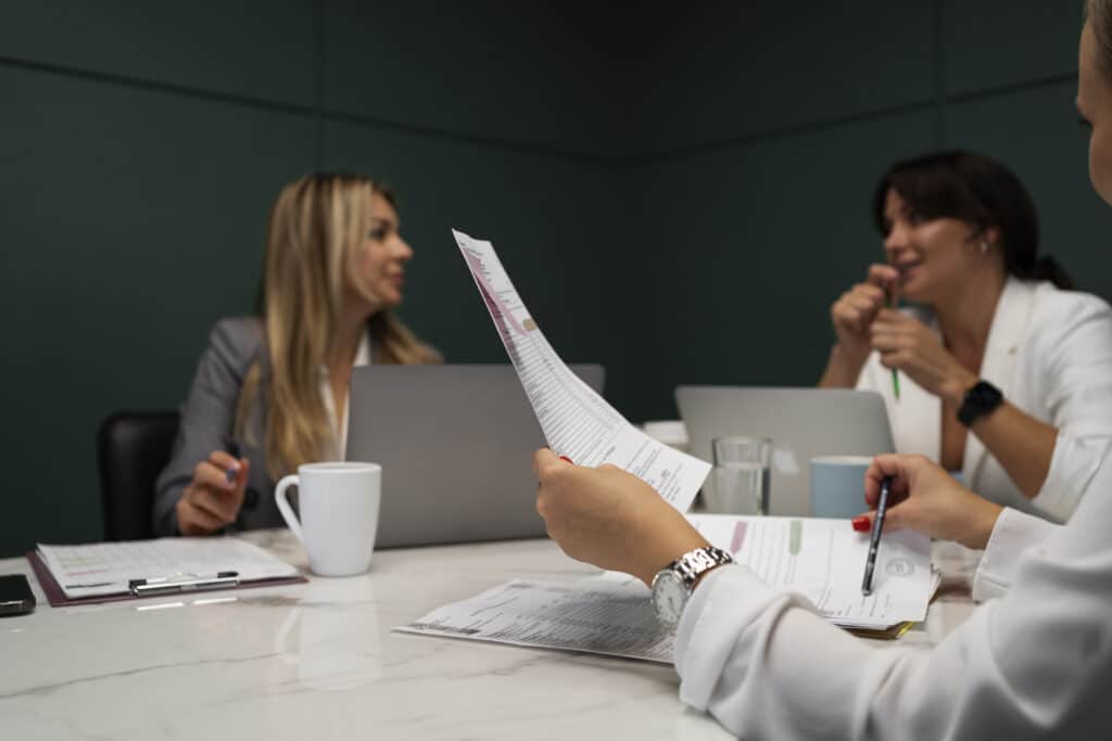 side-view-smiley-women-working-together